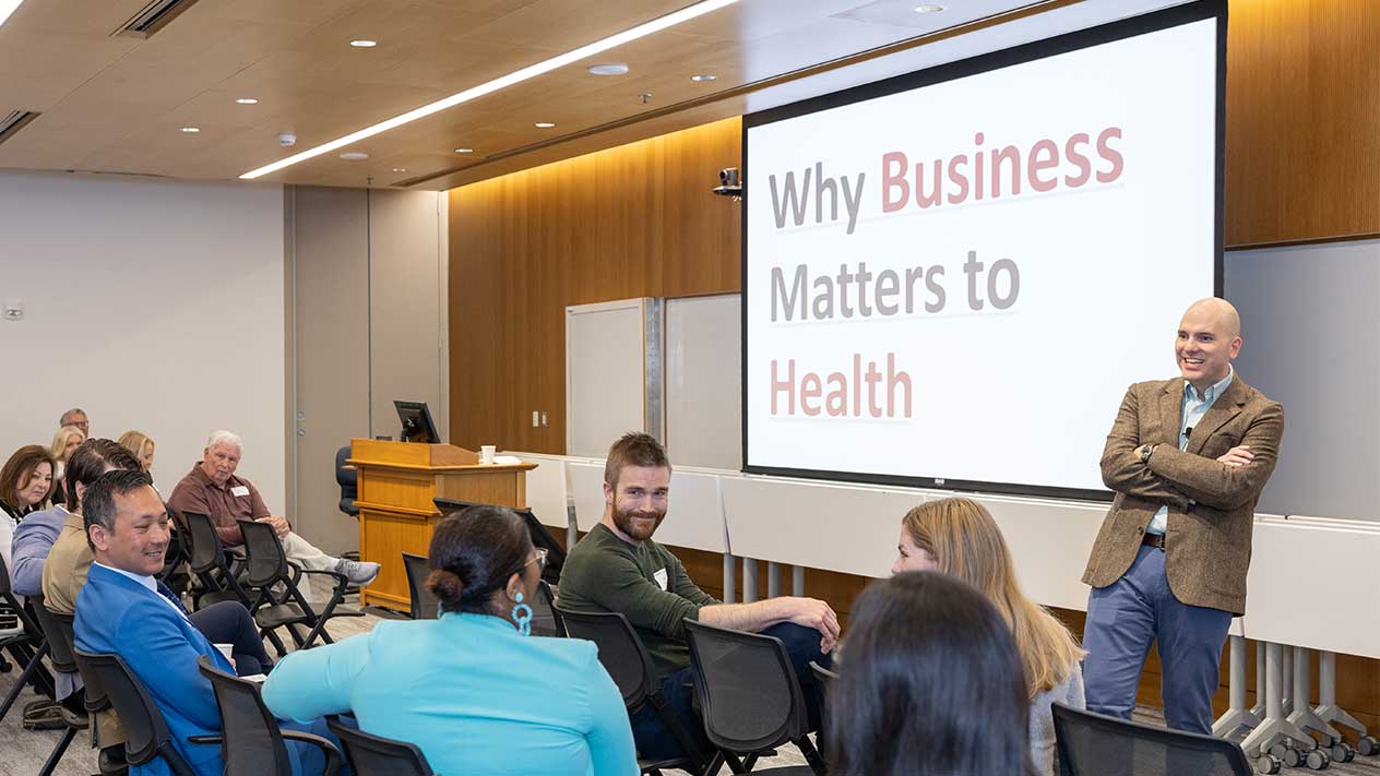 Business of Health director Patrick Aguilar leading a group discussion