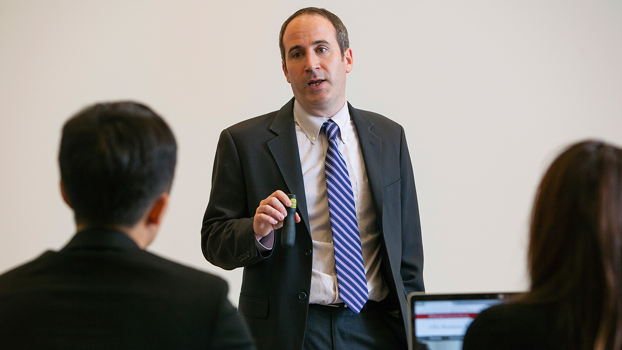 Professor lecturing DBA of Finance students