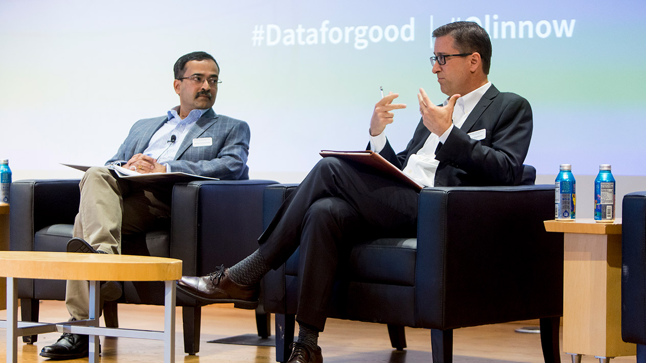 Olin faculty engaged in a panel discussion