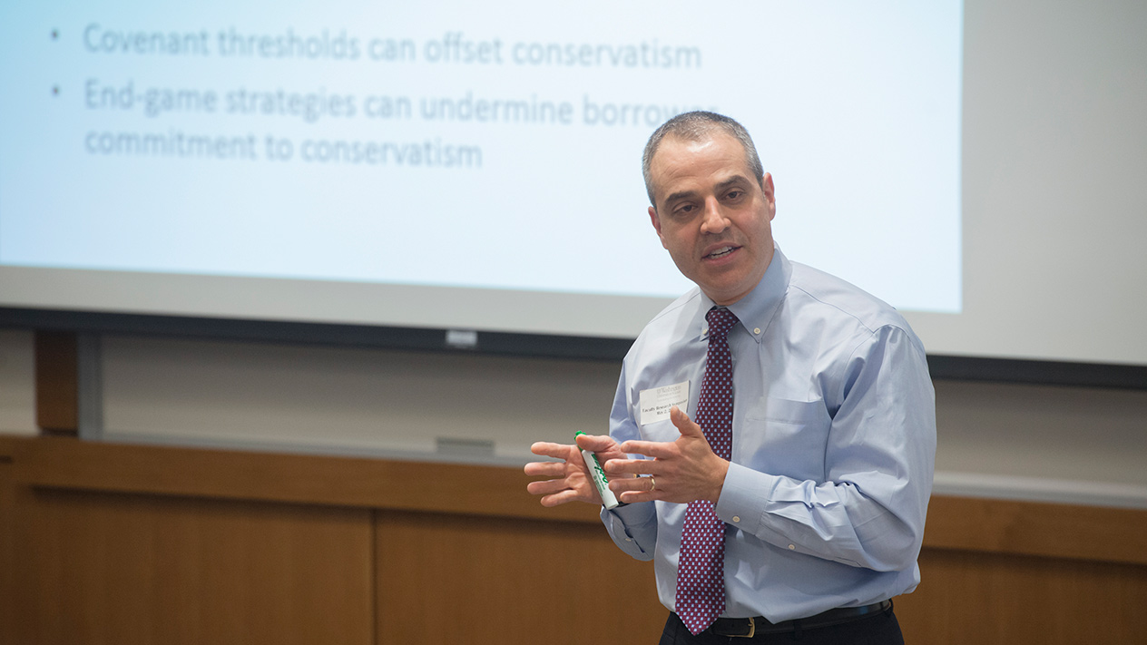 Professor conducting a PhD in Accounting course at Olin School of Business