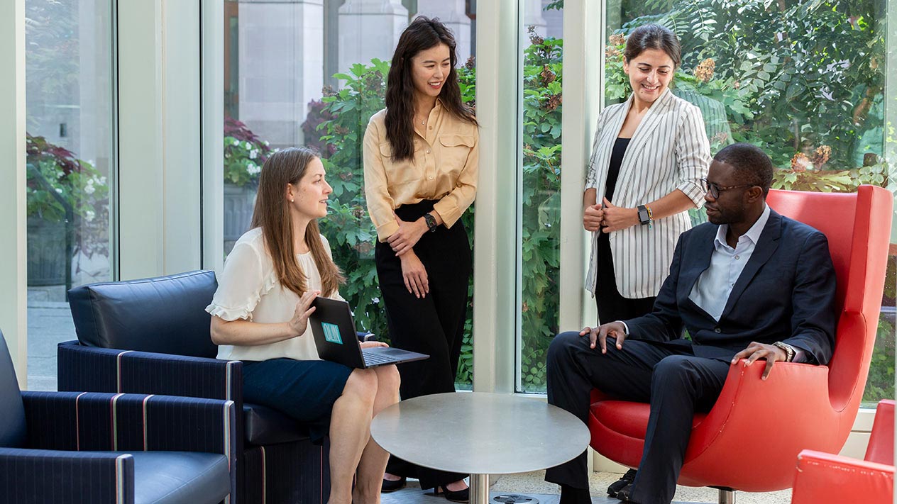 PhD Students discussing the PhD in Marketing program