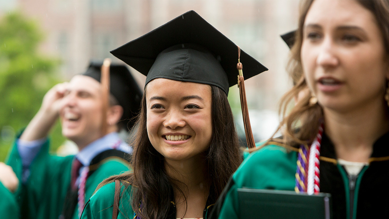A new BSBA graduate on graduation day.