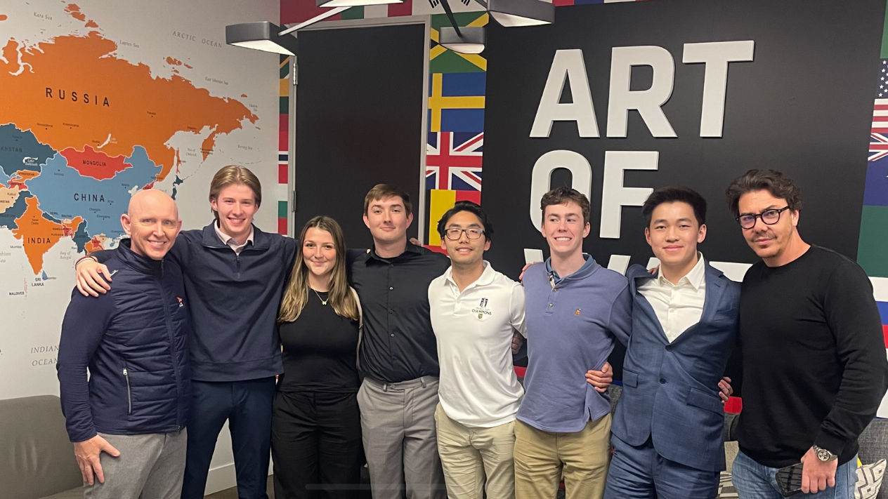 Students pose with UFC exec. 