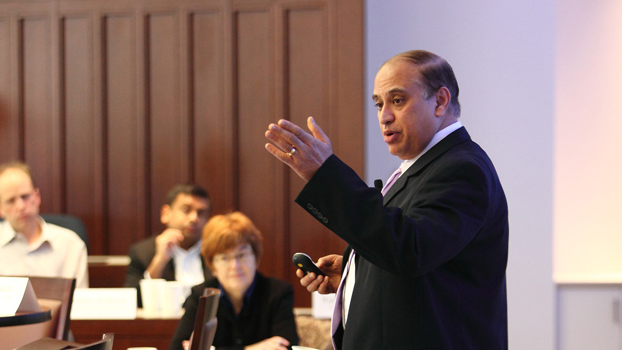Professor giving a lecture to PhD of Finance students at Olin School of Business