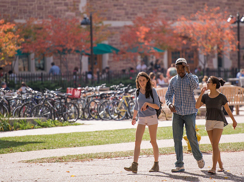 Image of Danforth Campus showing fountain outside of school on a sunny afternoon.