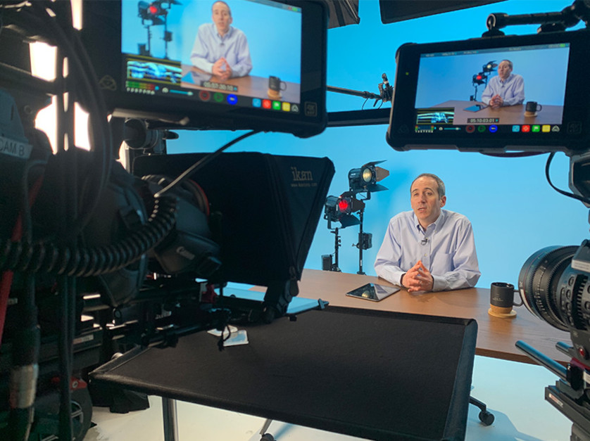 An Olin professor recording a module for an online course.