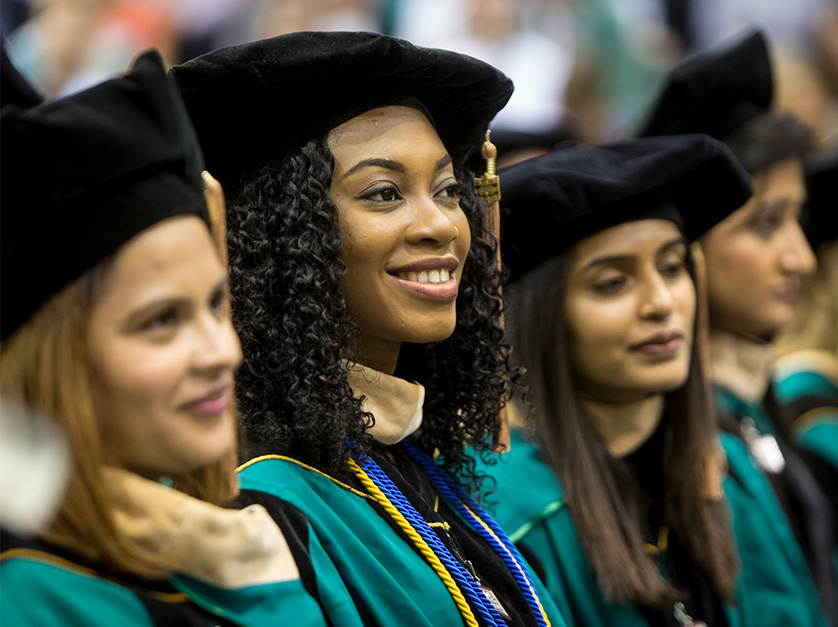 Graduate students listen to the ceremony