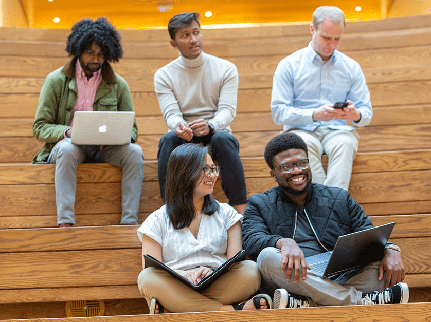 Olin MBA students connecting in the school's Frick Forum.