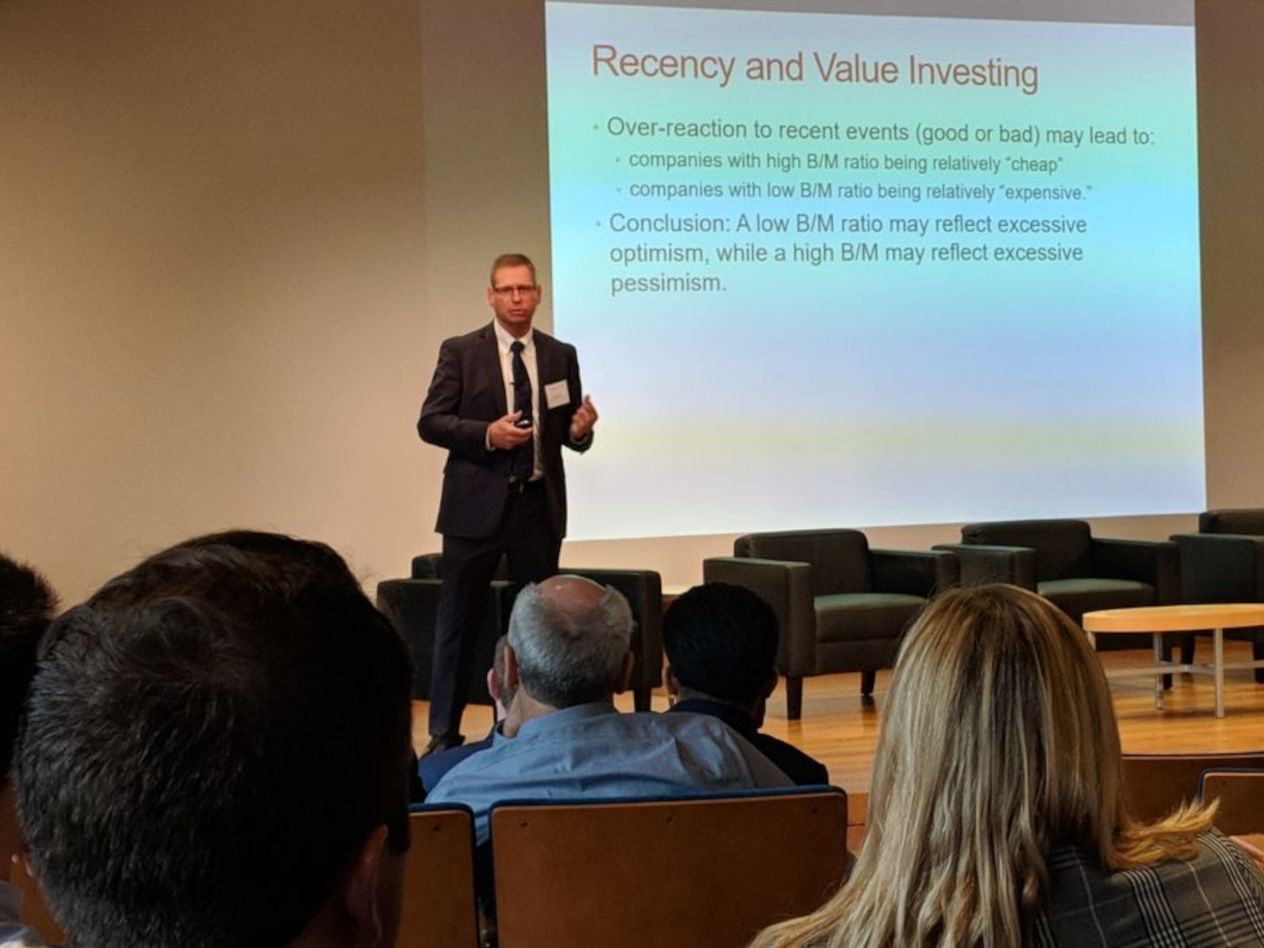 Ohad Kadan, H. Frederick Hagemann, Jr. Professor of Finance, conducting a summary of research in finance for attendees at the third annual wealth and asset management conference at Olin.