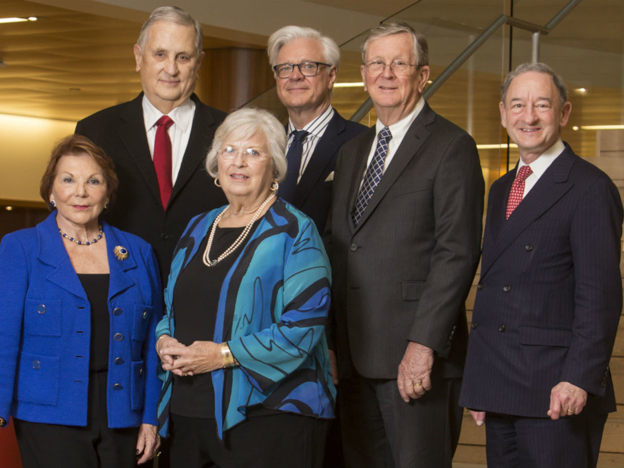 Fran and Elke Koch, first row. Paul Koch, Dean Mark Taylor, Roger Koch, and Chancellor Mark Wrighton