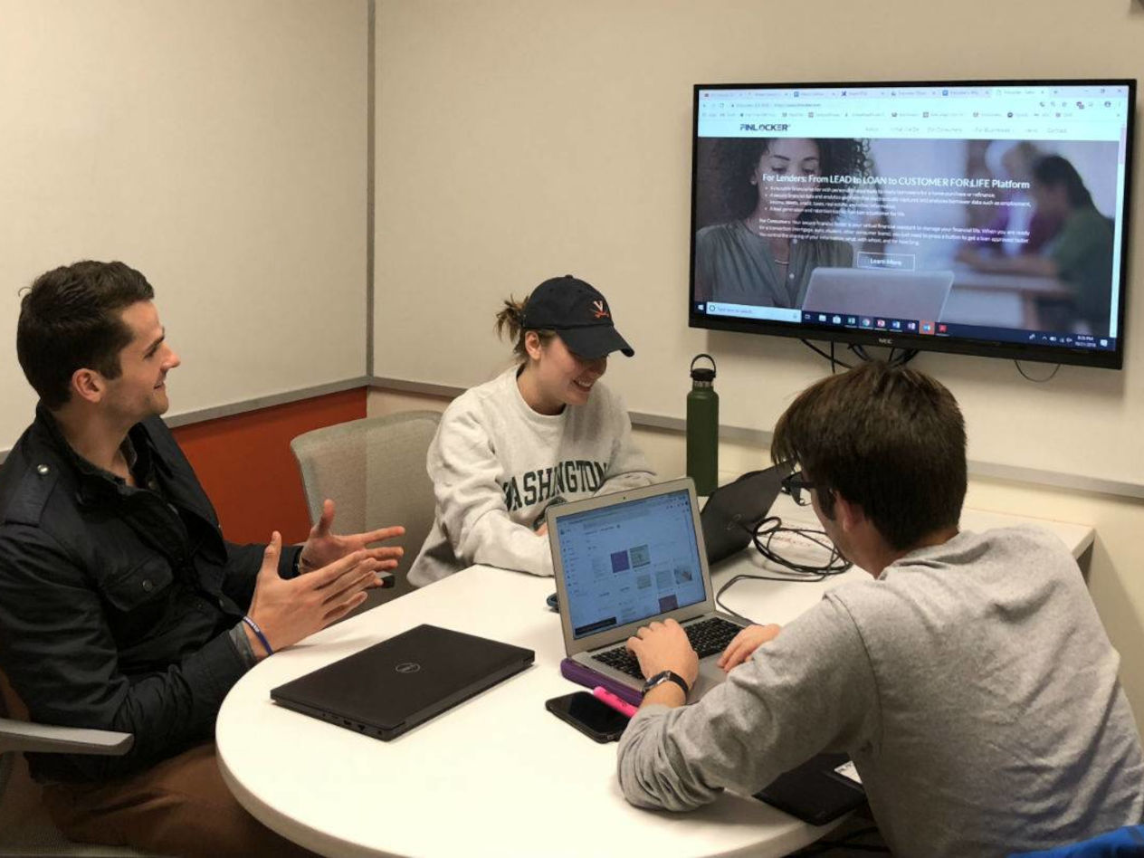 Paul Tychsen, Victoria Gravett, and Jack West working on their project.
