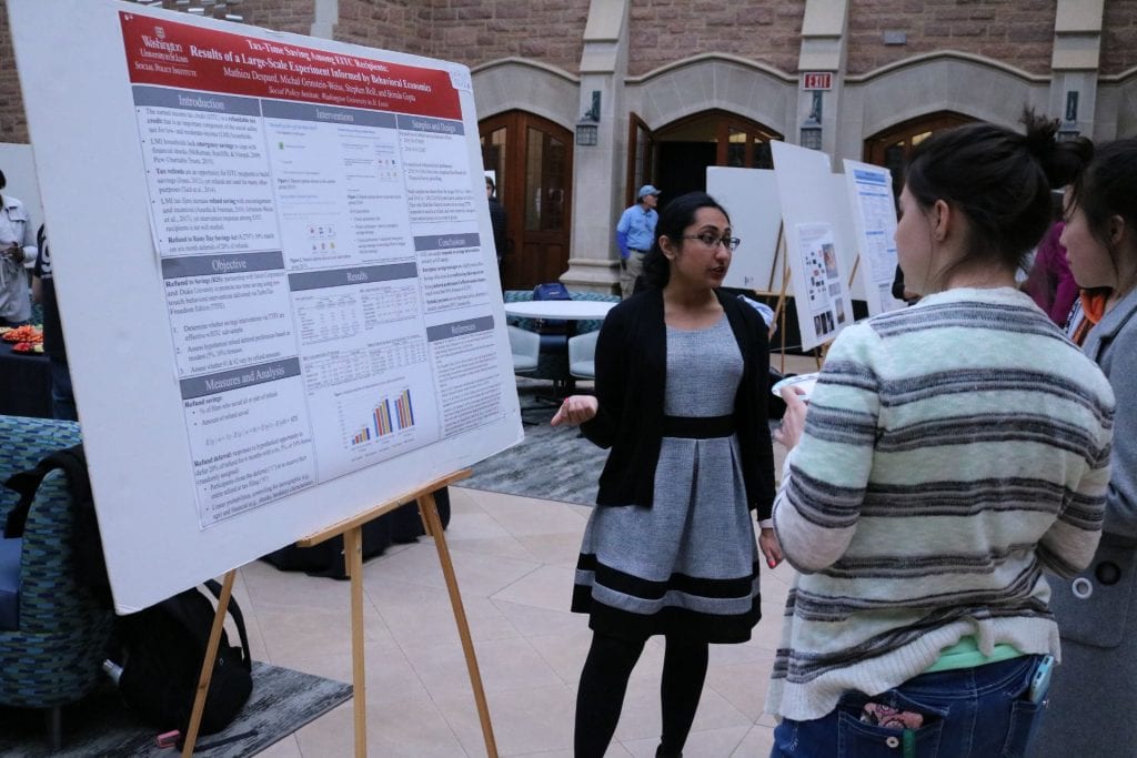 Graduate students participate in a symposium