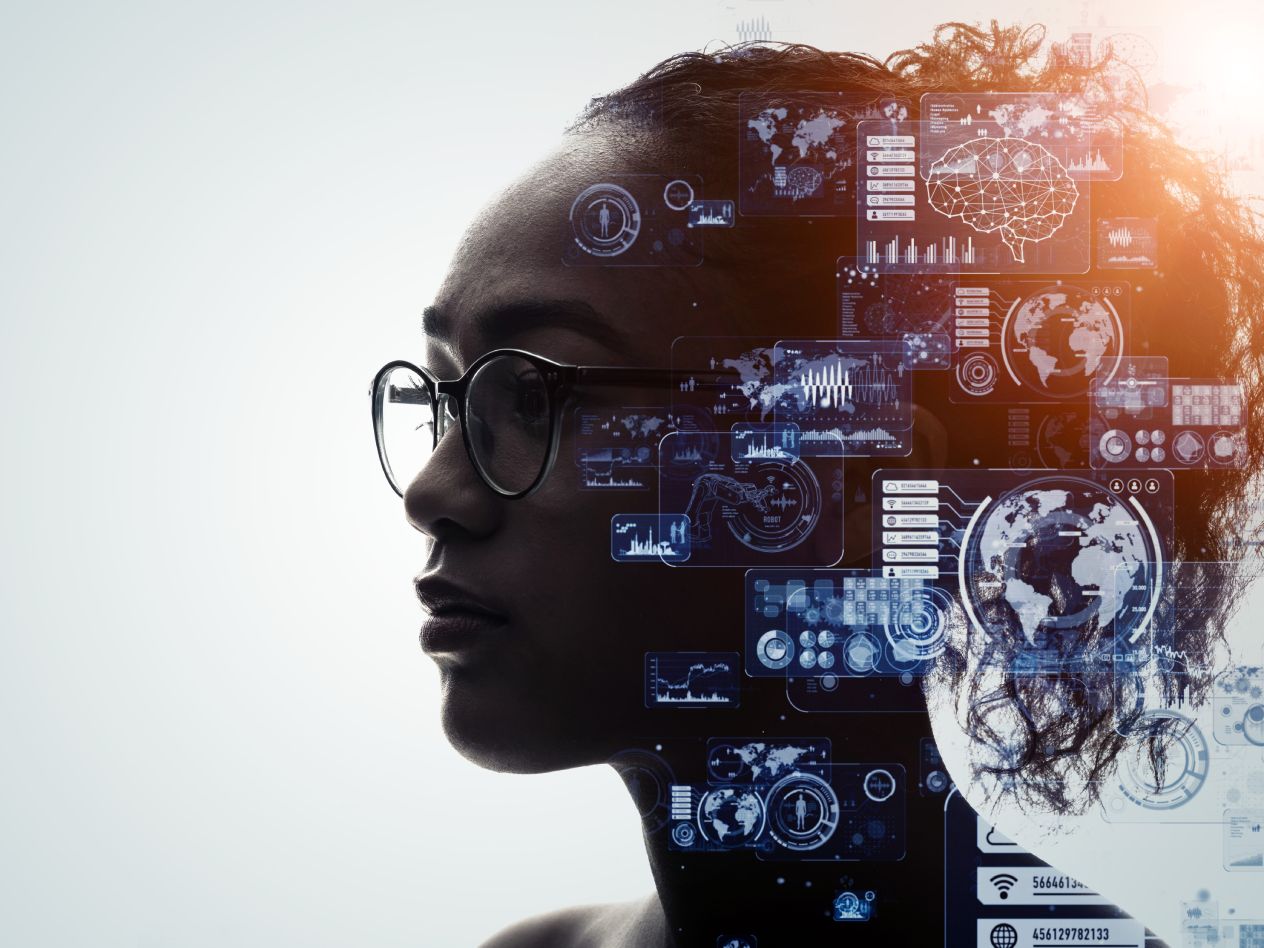 Woman looking toward the left of the white-framed background with images of technology overlaying the back of her head.