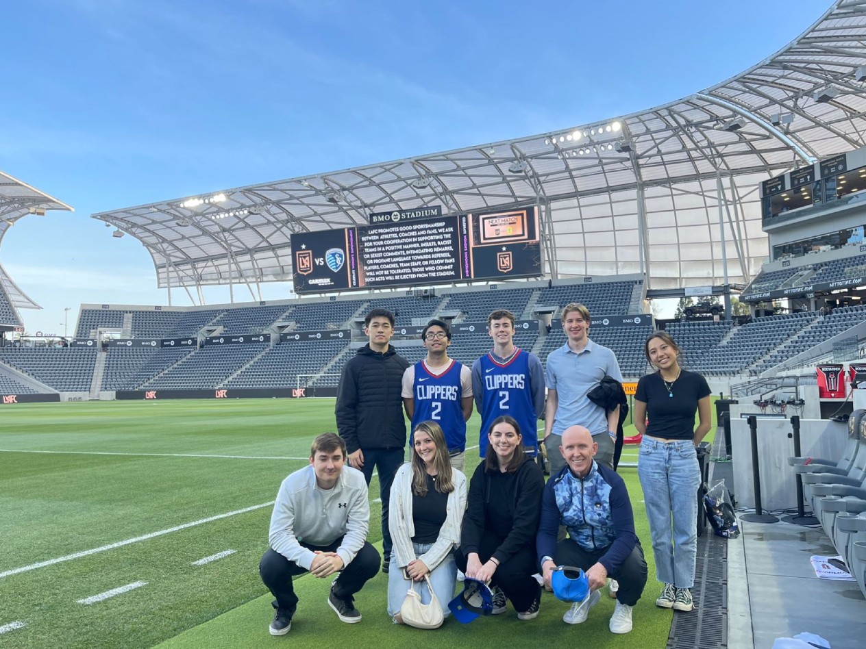Students on the spring sports trek gather on the pitch at BMO Stadium