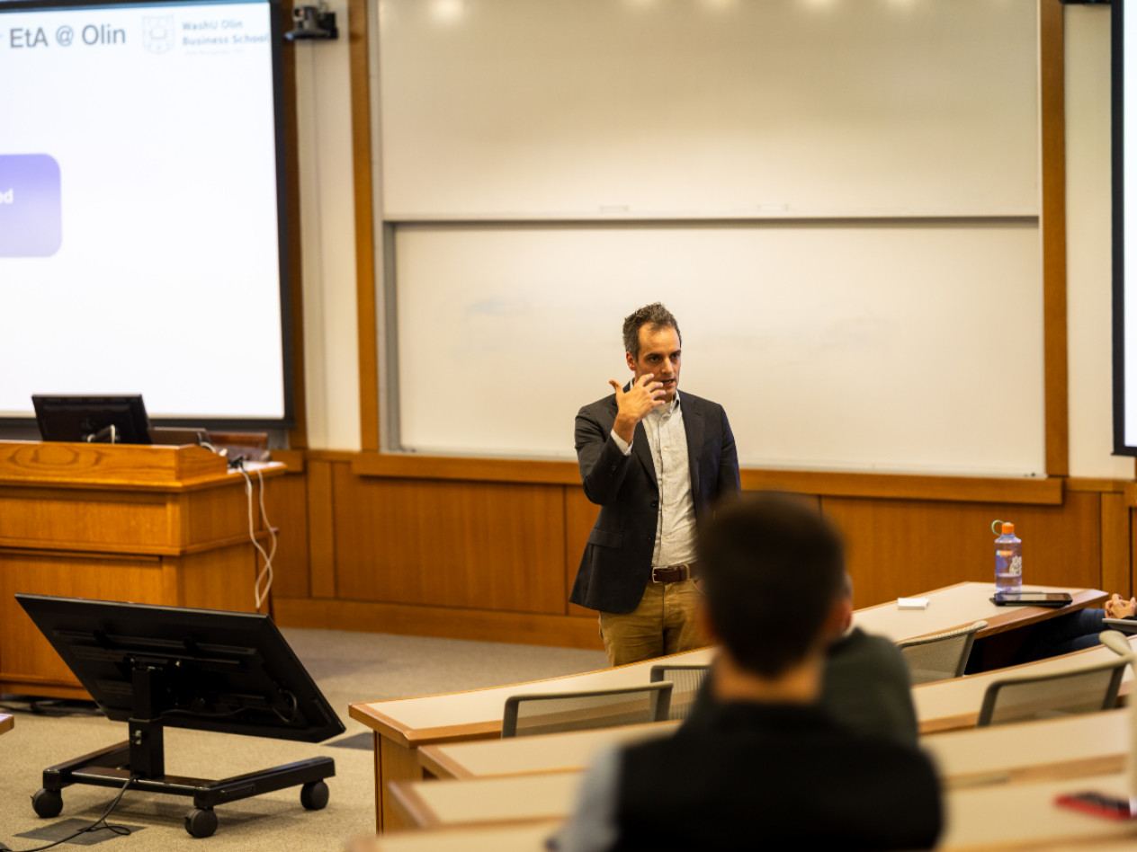 Professor Peter Boumgarden speaks to a group of students in a classroom.