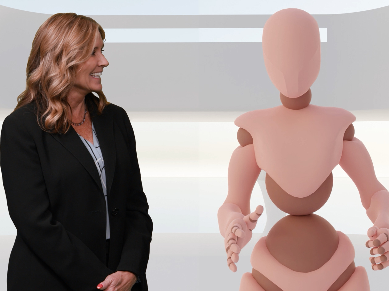 Professor Staci Thomas, shown with Synthia, an AI teaching assistant, as part of Thomas' AI for Communicators course