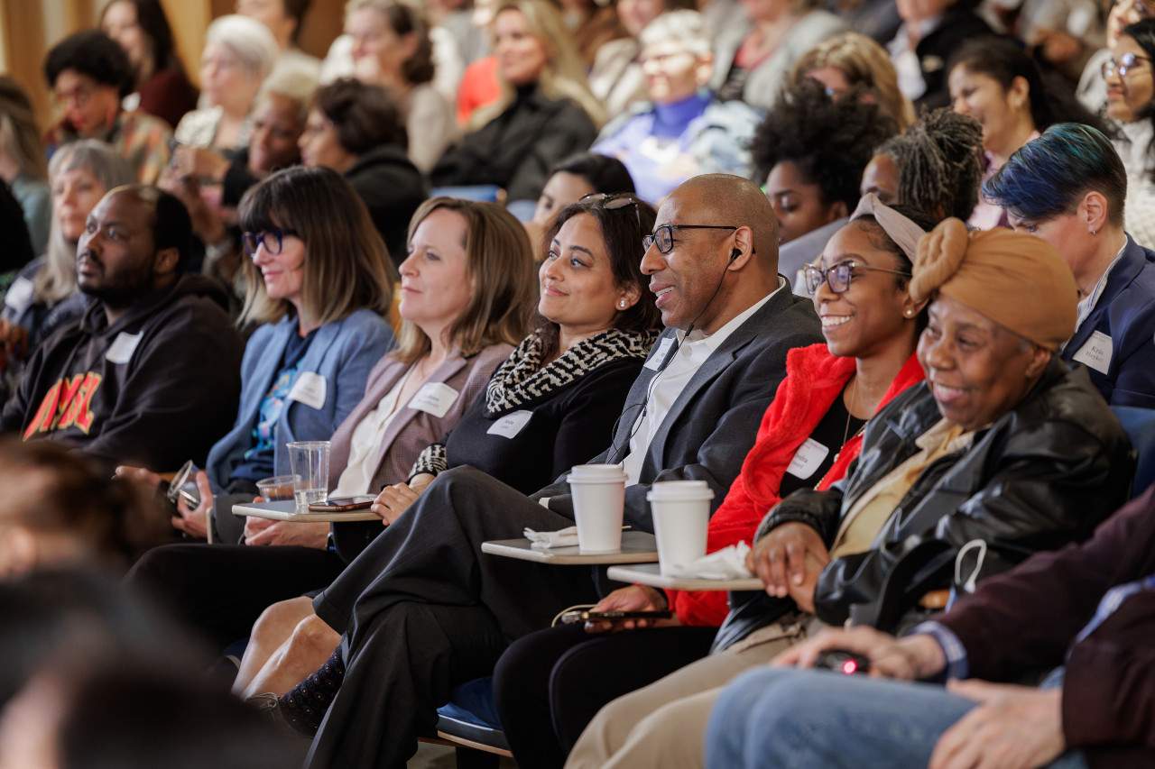 people seated in an auditorium
