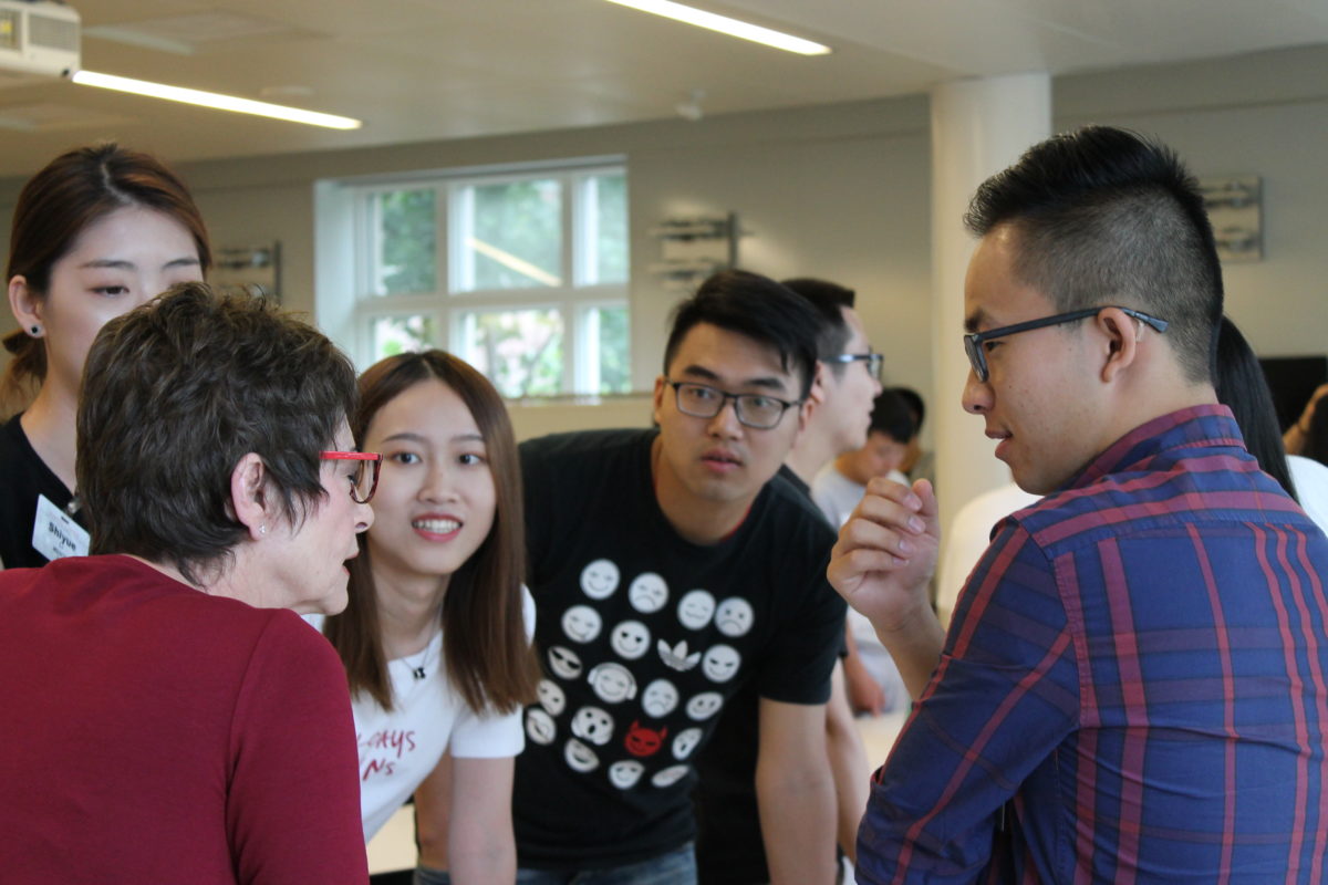 Students practice small talk with instructor Jackie Fredman.