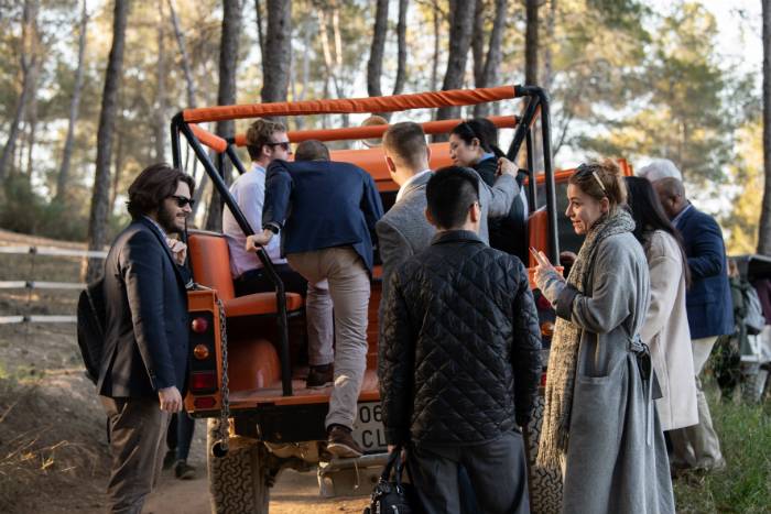 Students pile into a jeep during a tour and discussion of marketing needs at Barcelona’s Gramona Winery.