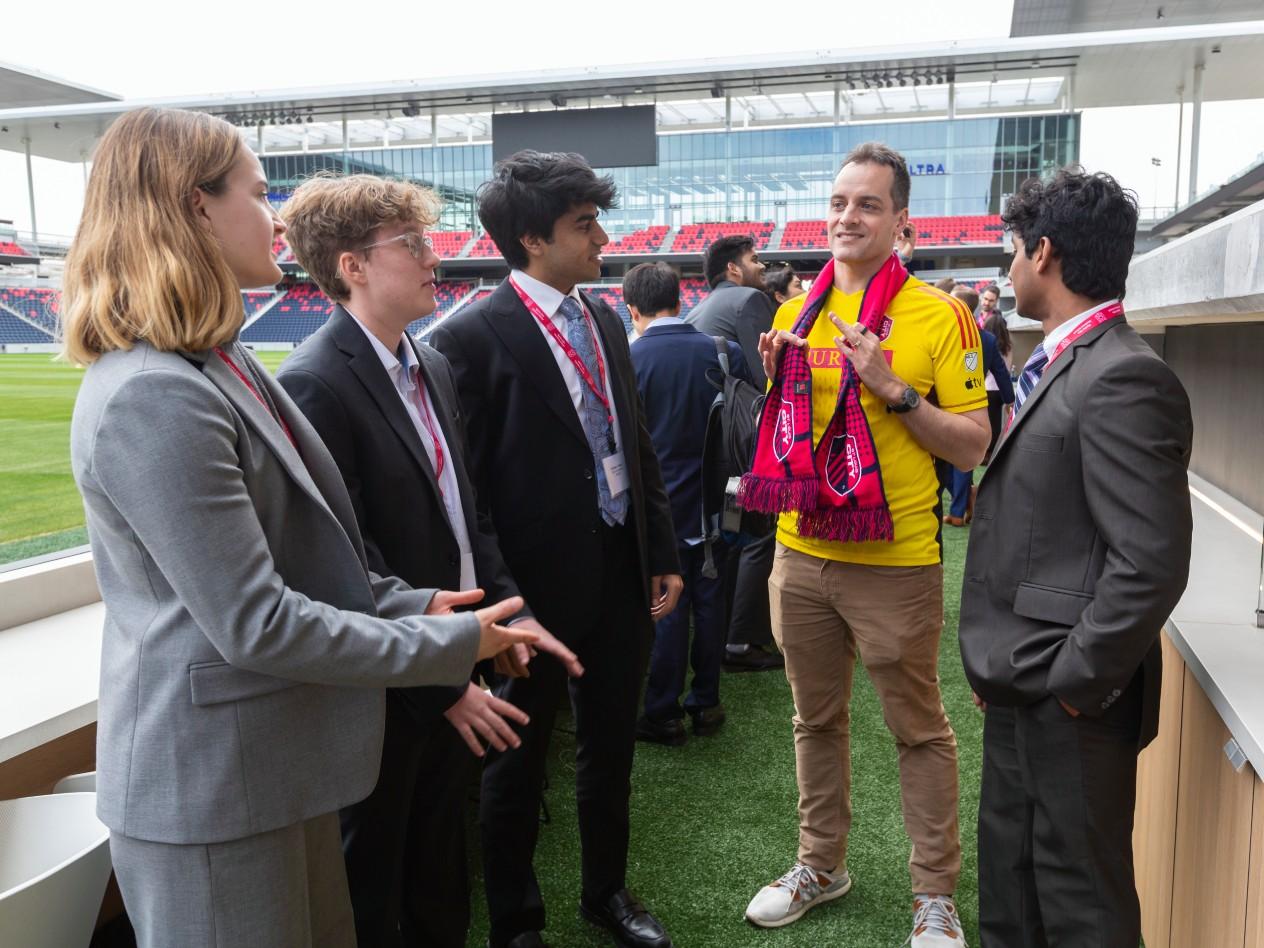Students with Peter Boumgarden near the pitch at CITY Park